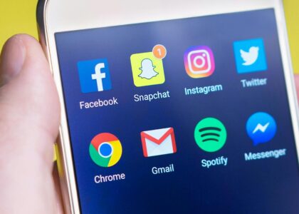 Person Holding Turned-on Android Smartphone